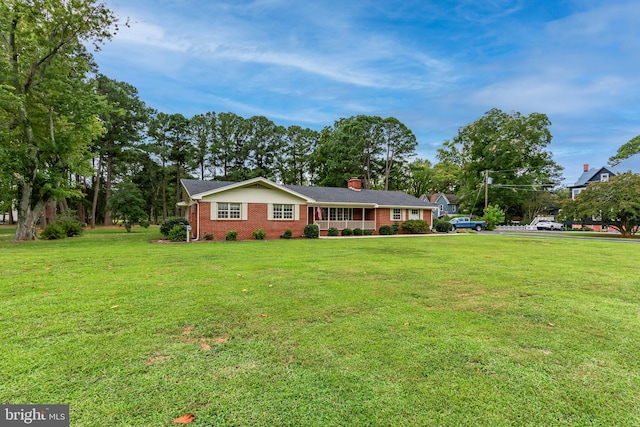 ranch-style home with a front yard