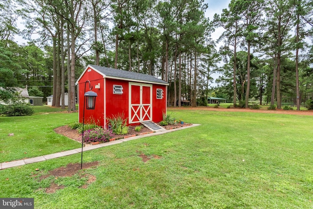 view of outbuilding with a lawn