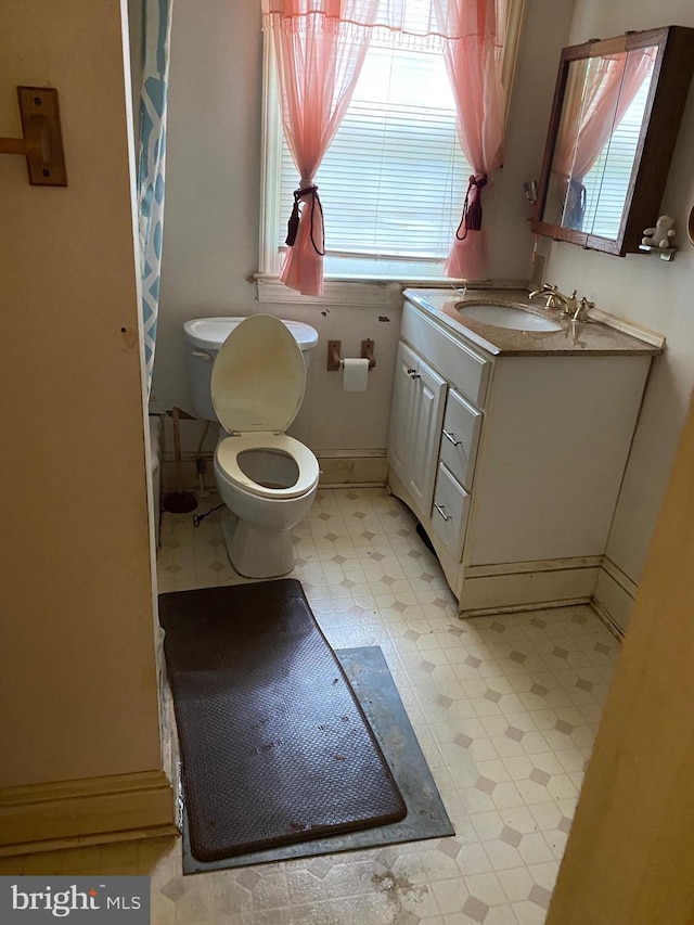 bathroom with vanity and toilet