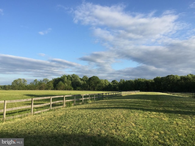 view of yard with a rural view