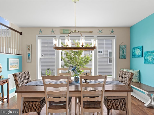 dining space featuring wood-type flooring