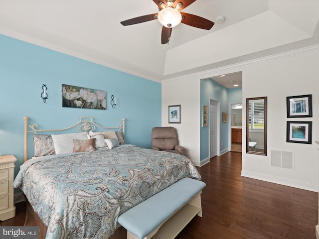 bedroom featuring connected bathroom, ceiling fan, dark wood-type flooring, and crown molding