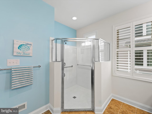 bathroom featuring tile patterned flooring and walk in shower