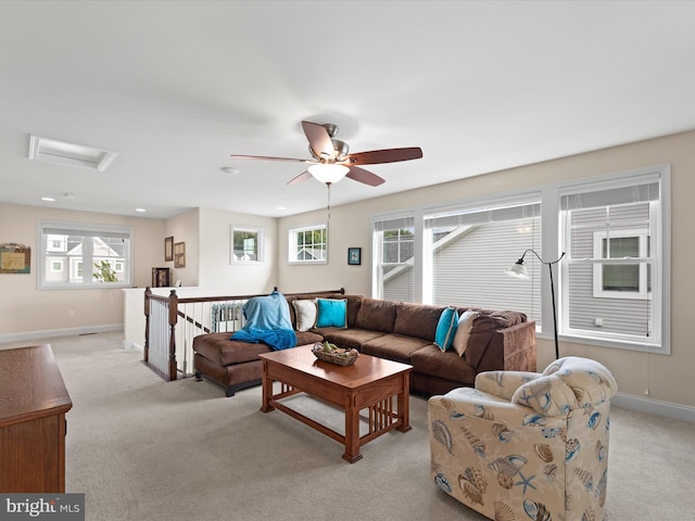 living room with ceiling fan and light colored carpet