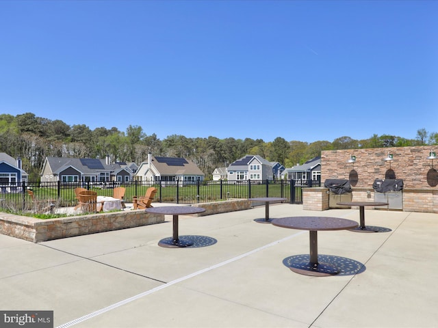 view of home's community with a patio area