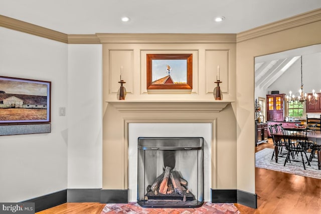 interior details with a notable chandelier, ornamental molding, beamed ceiling, and wood-type flooring