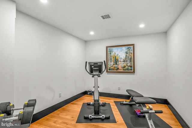 exercise area featuring wood-type flooring