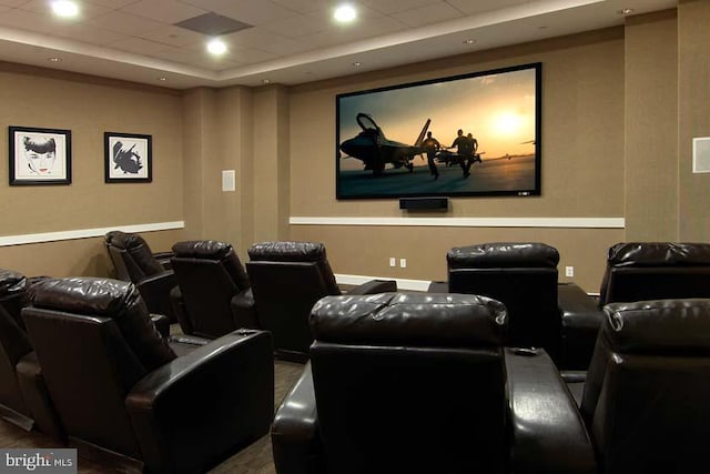 cinema featuring a paneled ceiling and recessed lighting