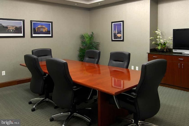 office featuring baseboards and light colored carpet