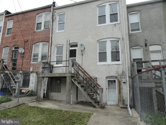 rear view of property with a patio area