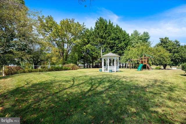 view of yard featuring a playground and a gazebo