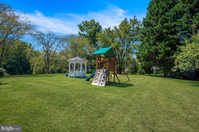 view of yard featuring a playground and a gazebo