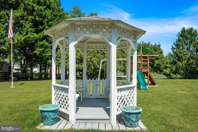 exterior space featuring a playground, a gazebo, and a yard