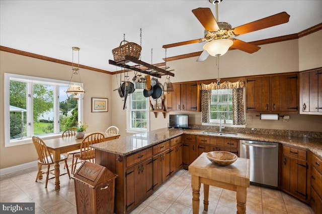 kitchen featuring dishwasher, pendant lighting, ceiling fan, ornamental molding, and sink