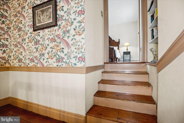 stairway featuring hardwood / wood-style flooring