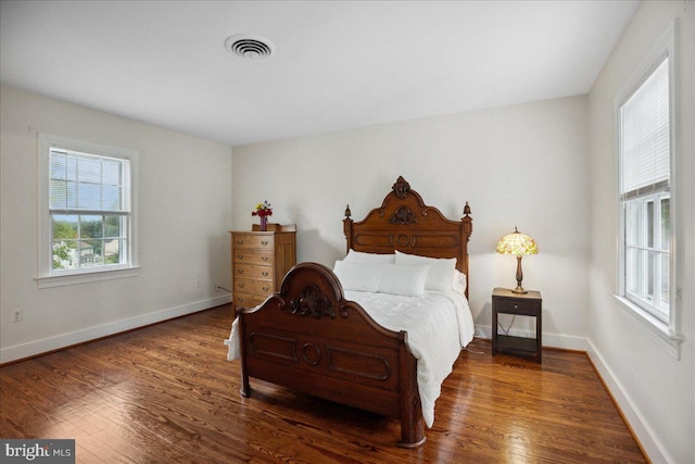 bedroom featuring dark hardwood / wood-style floors