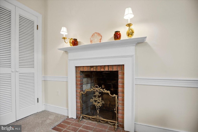 details featuring carpet and a brick fireplace