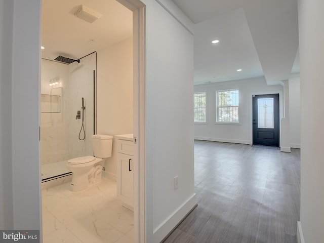 hallway featuring light tile patterned flooring