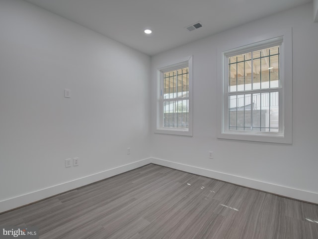 unfurnished room featuring light wood-type flooring