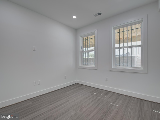 spare room with light hardwood / wood-style floors