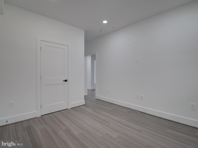 spare room with light hardwood / wood-style floors