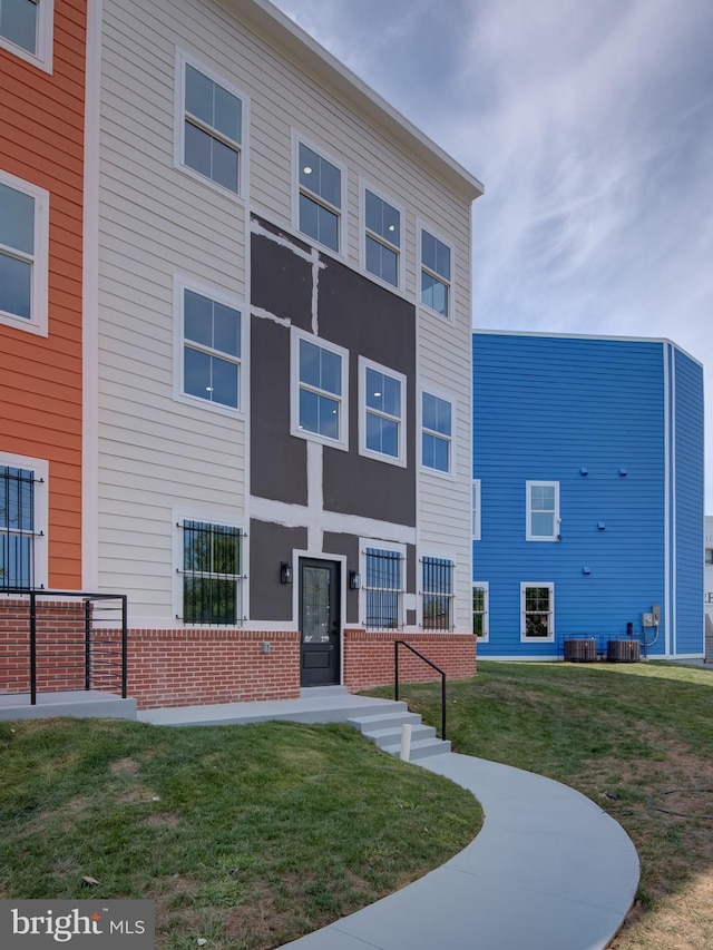 view of property featuring central AC unit