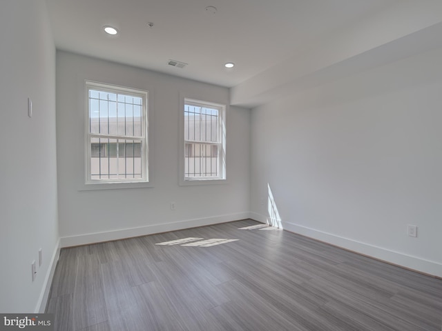 spare room featuring light hardwood / wood-style floors