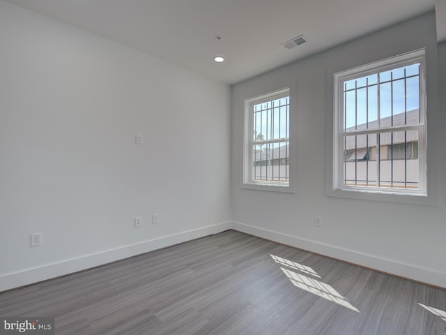 spare room featuring light hardwood / wood-style floors