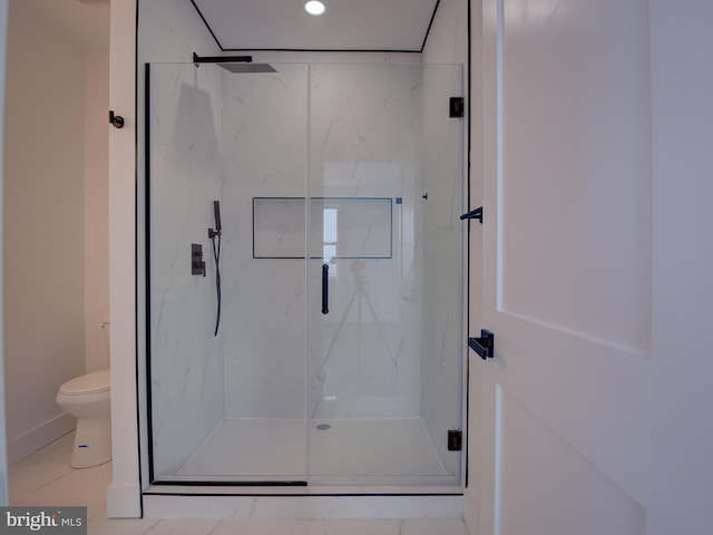 bathroom featuring an enclosed shower, tile patterned flooring, and toilet