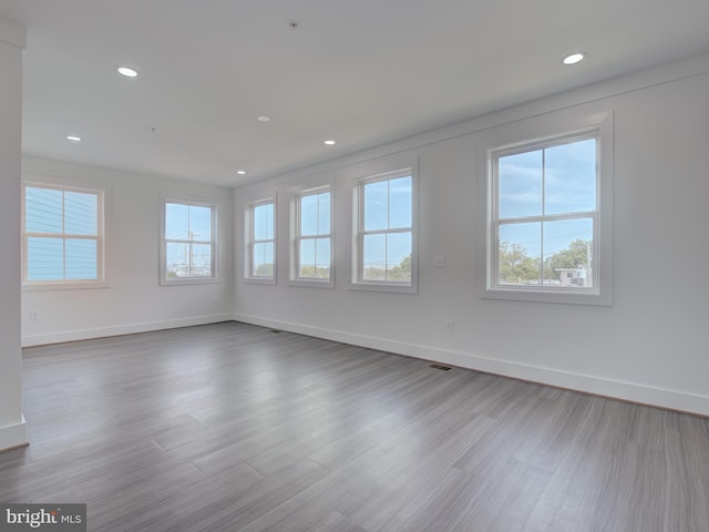 unfurnished room featuring hardwood / wood-style floors