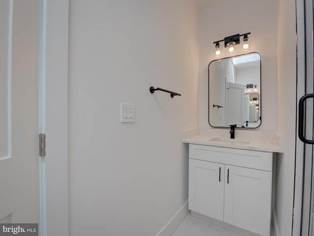 bathroom featuring tile patterned flooring and vanity