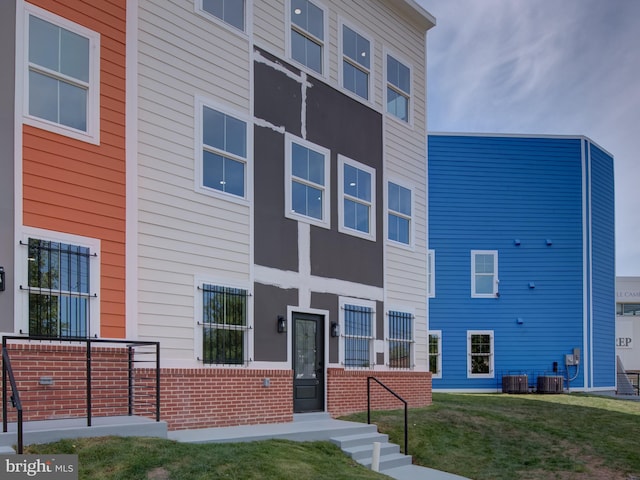 view of building exterior with central air condition unit