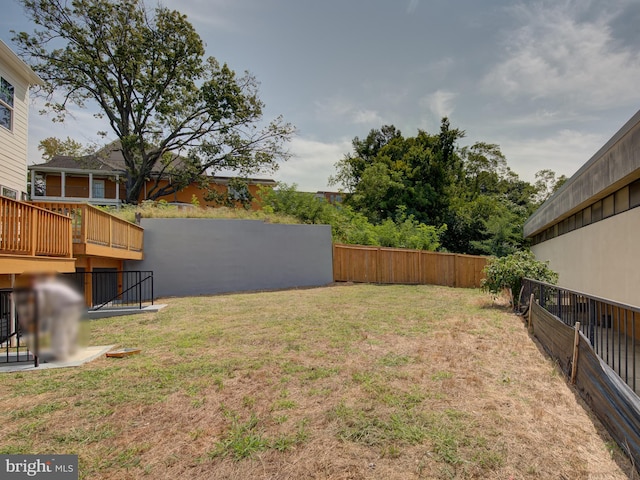 view of yard with a wooden deck