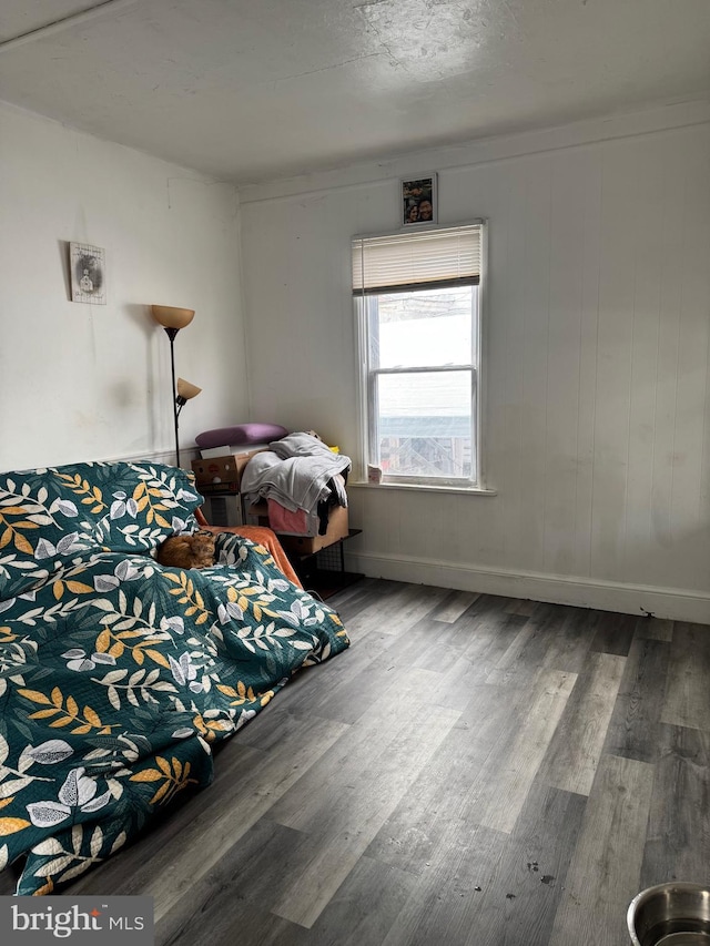 bedroom with wood-type flooring