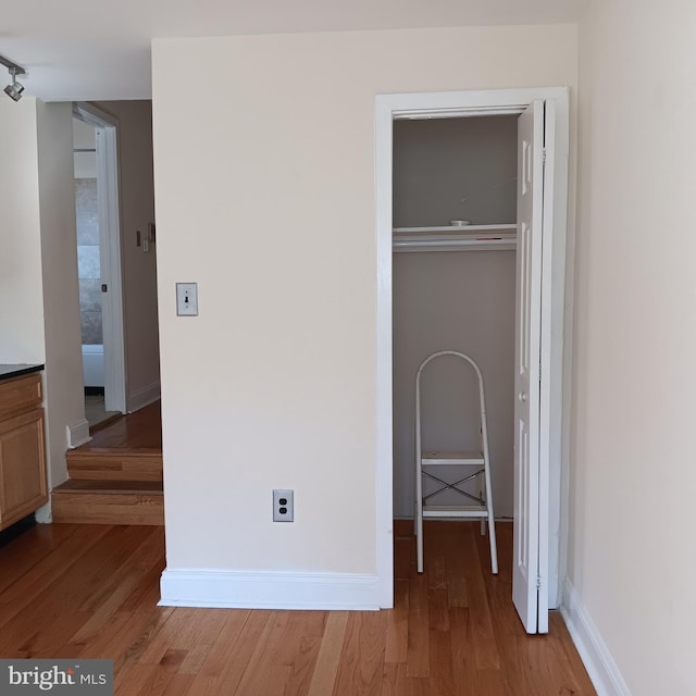 unfurnished bedroom featuring hardwood / wood-style flooring