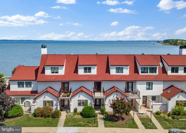 view of front of home featuring a water view and a front yard