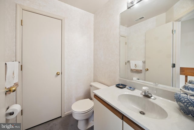 bathroom with vanity and toilet