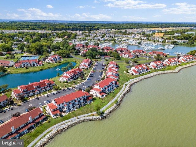 birds eye view of property with a water view