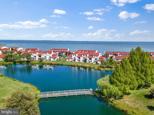 birds eye view of property with a residential view and a water view