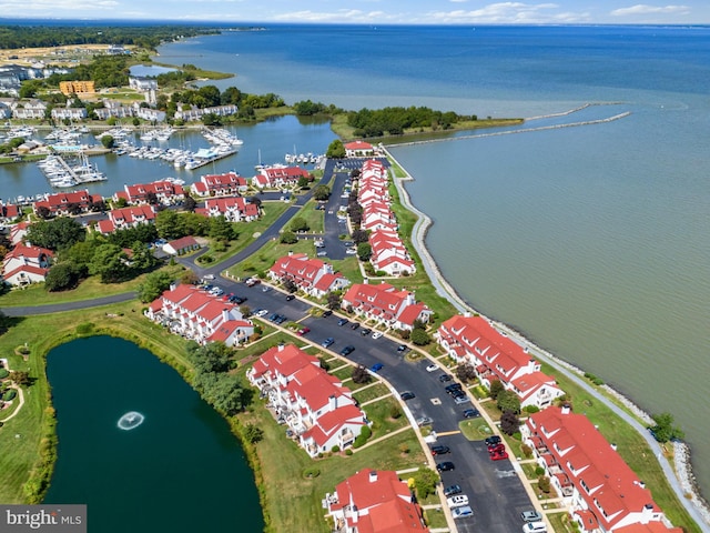 birds eye view of property featuring a water view