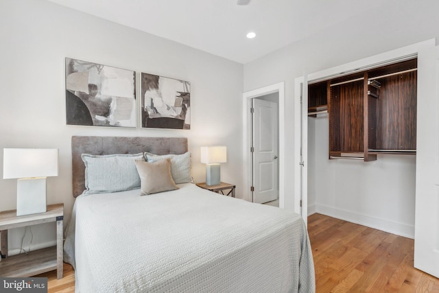 bedroom with a closet and light wood-type flooring