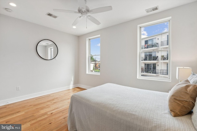 bedroom featuring ceiling fan and light wood-type flooring