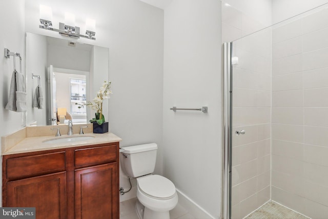 bathroom with vanity, toilet, an enclosed shower, and tile patterned floors