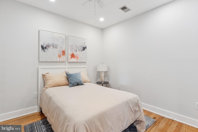 bedroom featuring light hardwood / wood-style flooring and ceiling fan