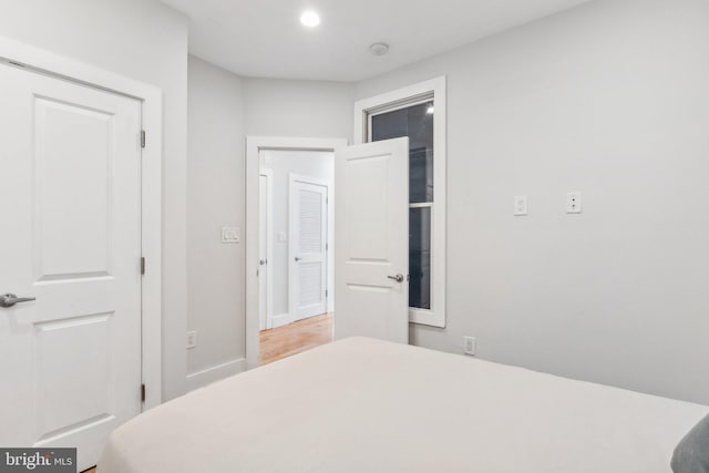 bedroom with wood-type flooring