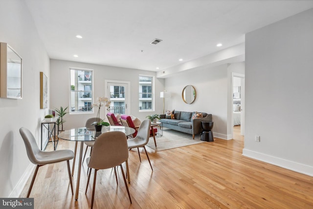 dining room with light hardwood / wood-style floors