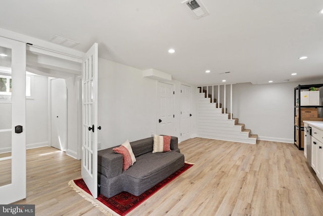 living area with light hardwood / wood-style flooring