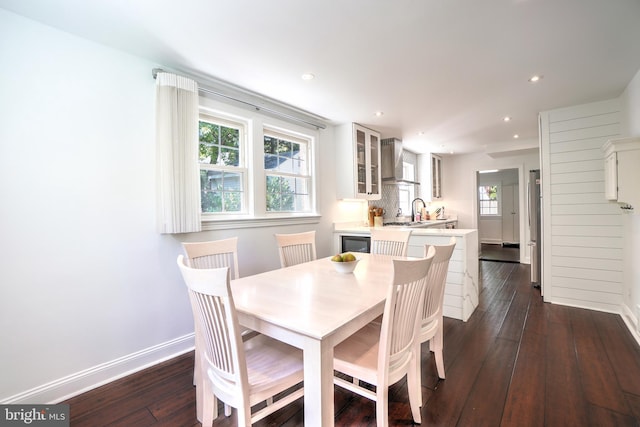 dining area with dark hardwood / wood-style floors