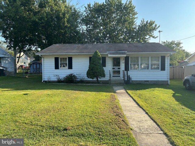 ranch-style house with a front yard