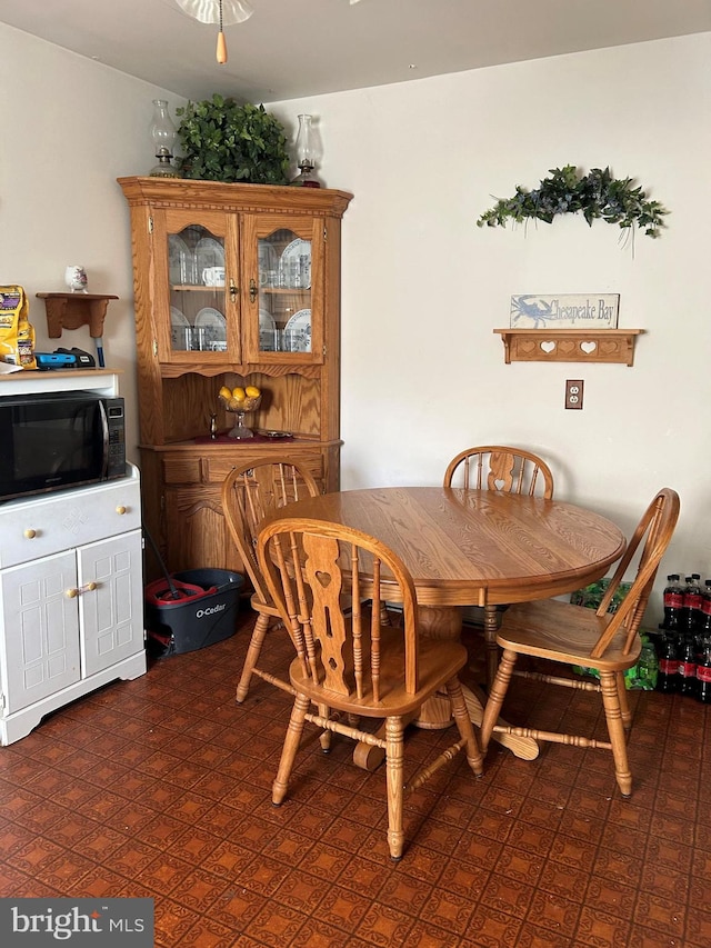 dining room with dark floors